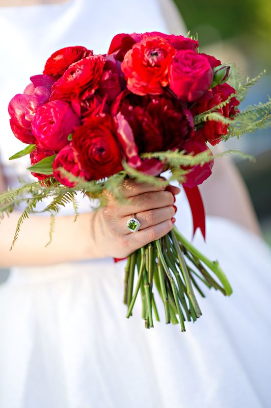 Bride holding red bridal bouquet