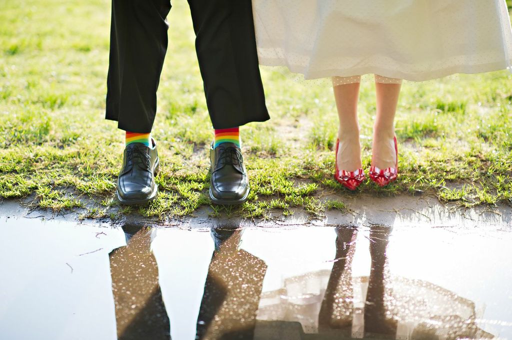 Bride and Groom with colorful socks and red heels
