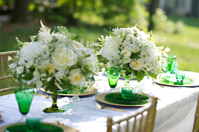 Outdoor reception with green and white decor